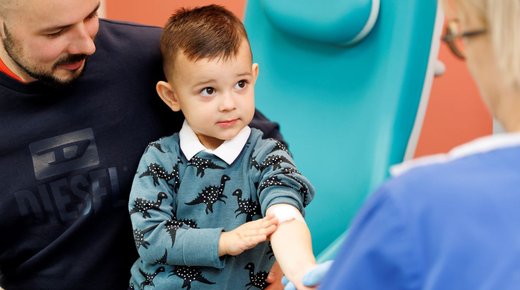 Child with Arm needle Stock
