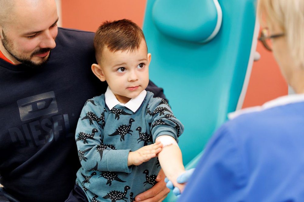 Child with Arm needle Stock